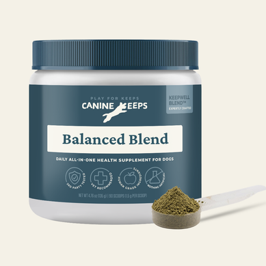 Canine Keeps supplement jar with a scoop of powder on a light background